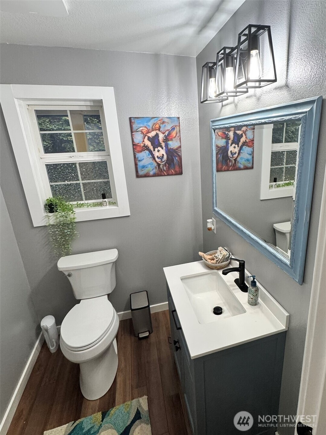 14444 Crescent Valley Road Southeast Olalla, WA 98359 - Photo 12 of 31 a bathroom with a toilet a sink and a mirror