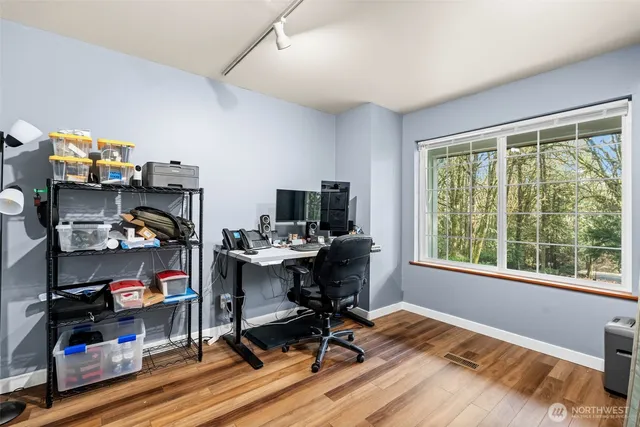 a view of a livingroom with furniture and white doors