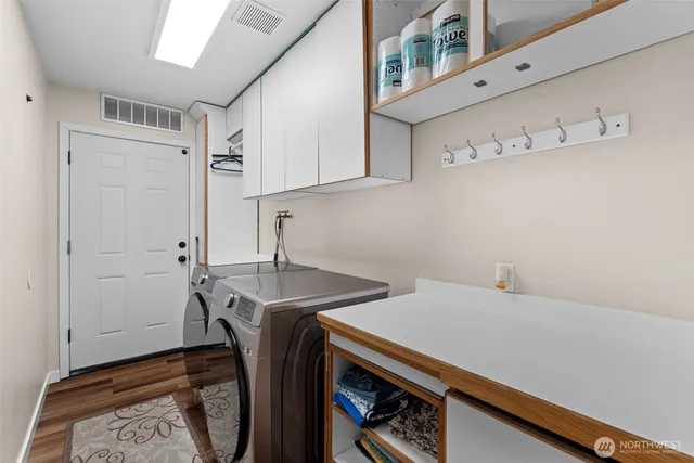 a view of a porch with chairs and backyard