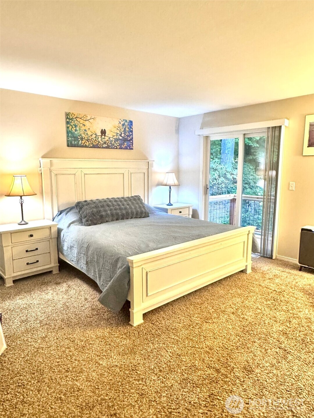 14444 Crescent Valley Road Southeast Olalla, WA 98359 - Photo 15 of 31 a spacious bedroom with a bed and a couch