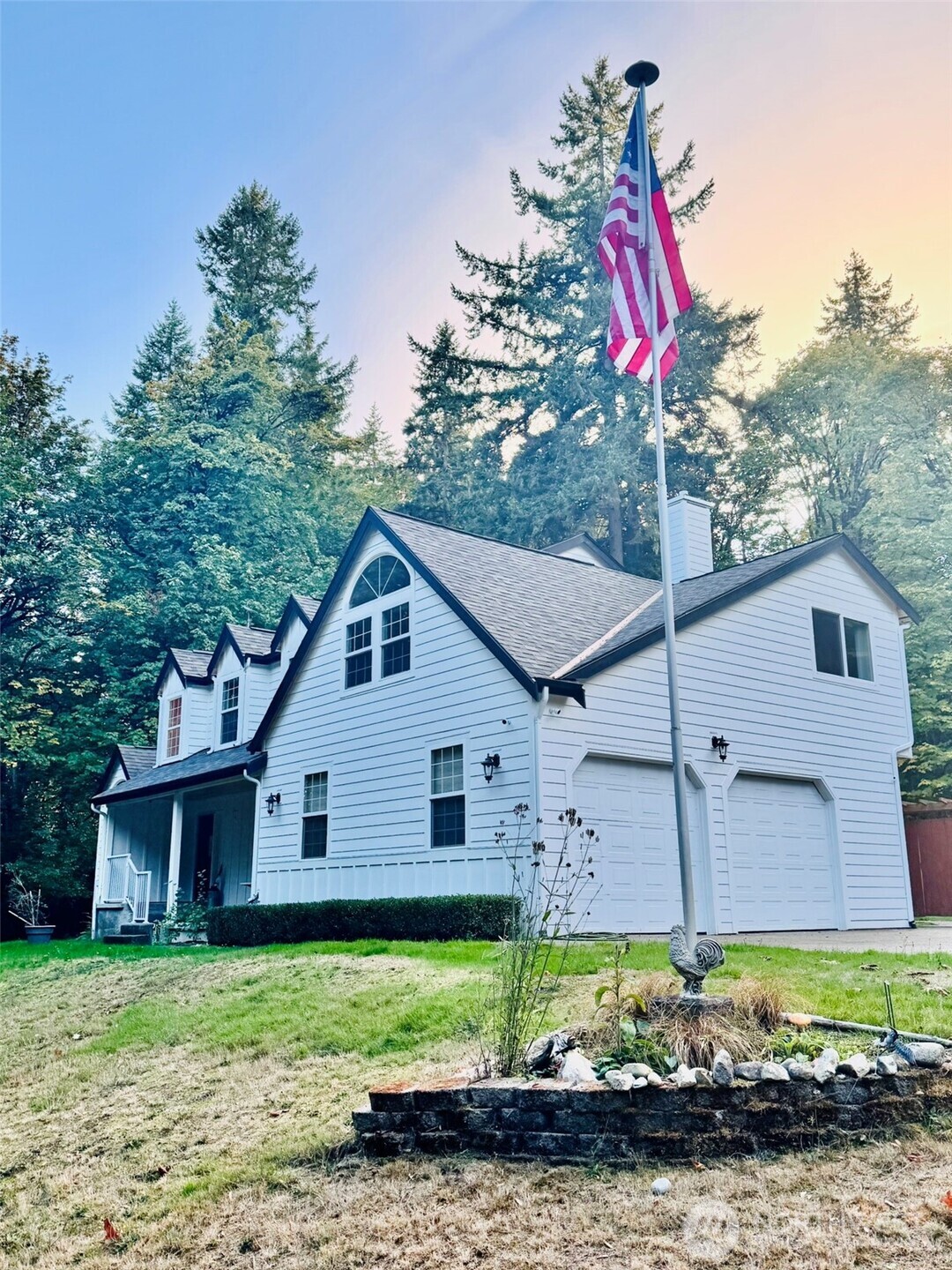 14444 Crescent Valley Road Southeast Olalla, WA 98359 - Photo 2 of 31 a front view of a house with a yard and garage