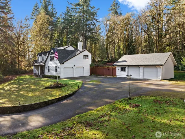 a view of entryway with furniture and wooden floor