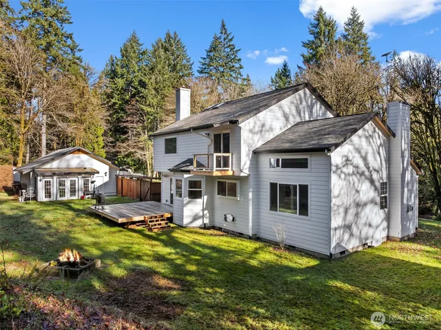 a living room with furniture wooden floor and a potted plant