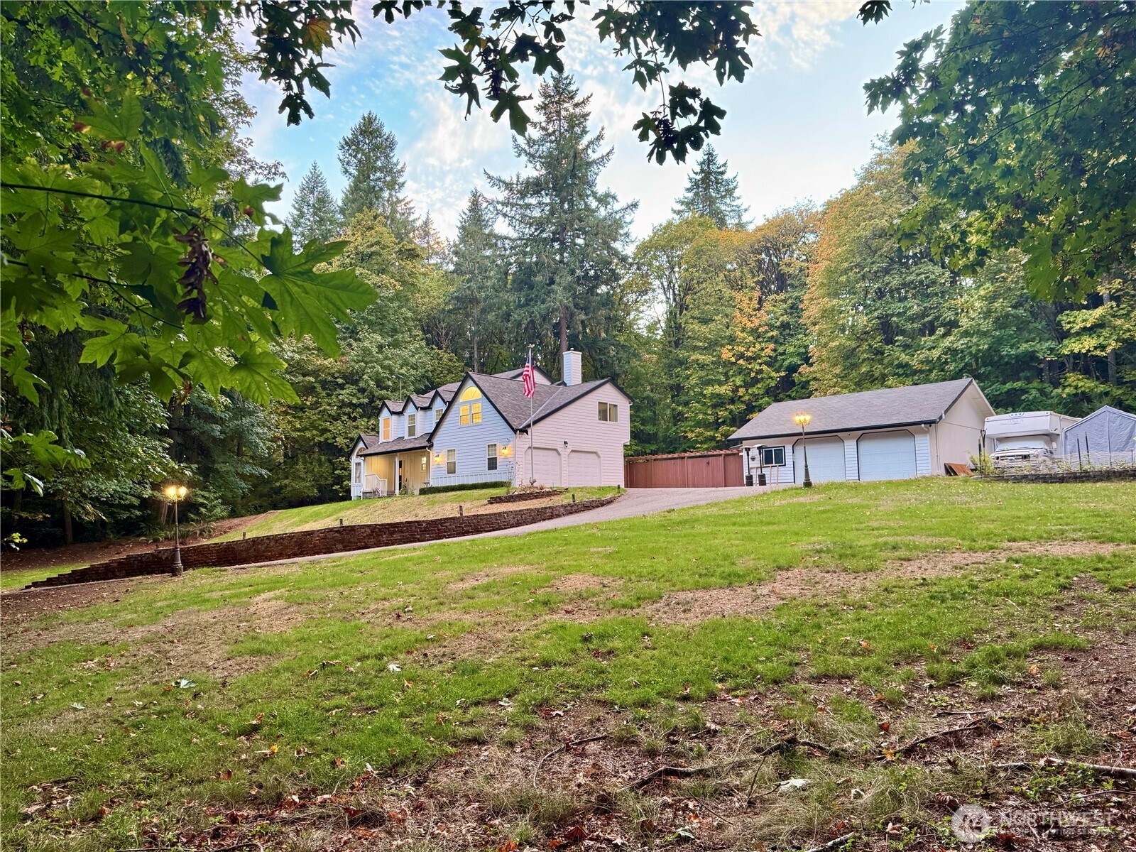 14444 Crescent Valley Road Southeast Olalla, WA 98359 - Photo 31 of 31 a view of a house with a yard and a large tree