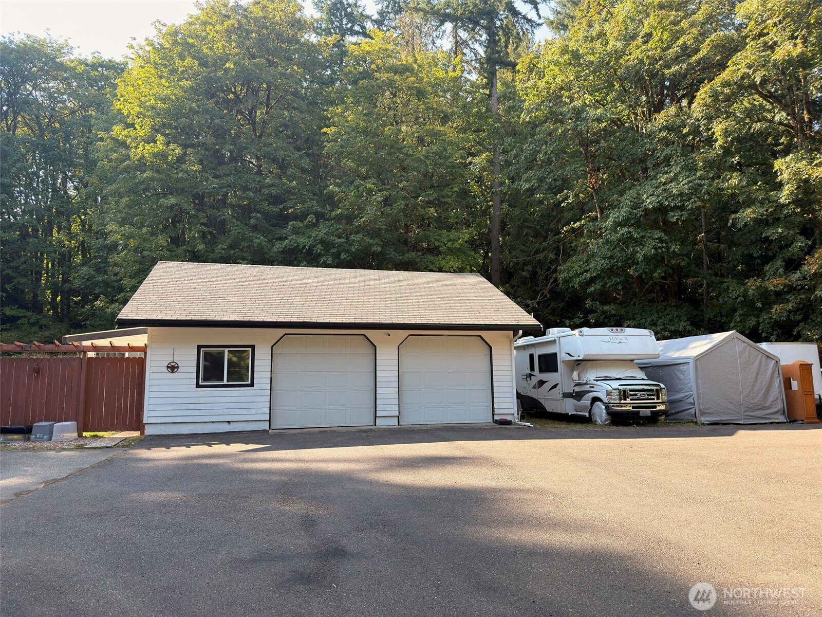 14444 Crescent Valley Road Southeast Olalla, WA 98359 - Photo 4 of 31 a car parked in front of a house