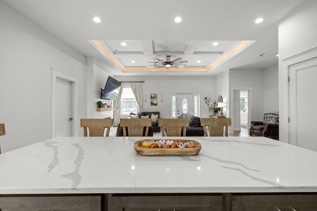 1014 Southwest 11th Street Okeechobee, FL 34974 - Photo 11 of 45 a living room with lots of furniture and kitchen view