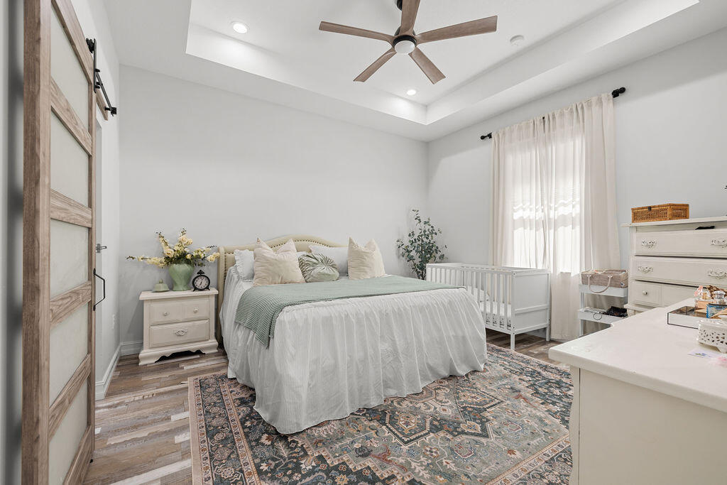 1014 Southwest 11th Street Okeechobee, FL 34974 - Photo 17 of 45 a bedroom with a large bed and a window