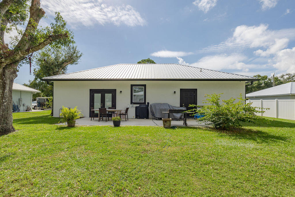 1014 Southwest 11th Street Okeechobee, FL 34974 - Photo 2 of 45 a view of a house with backyard porch and sitting area