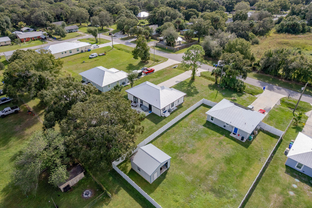 1014 Southwest 11th Street Okeechobee, FL 34974 - Photo 43 of 45 an aerial view of a house with a garden and swimming pool