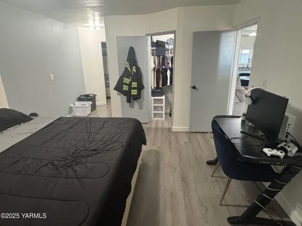a bathroom with a toilet and a shower curtain