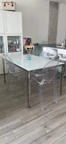 a room with a table and chairs