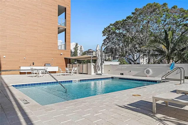 a view of a swimming pool with a patio