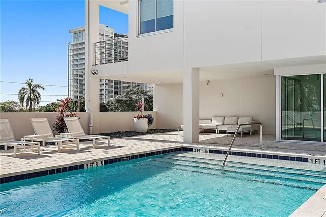 a view of pool table and chairs