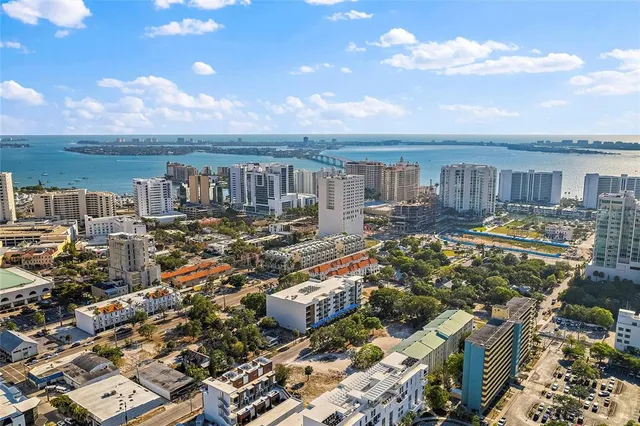 a view of a lake with lawn chairs