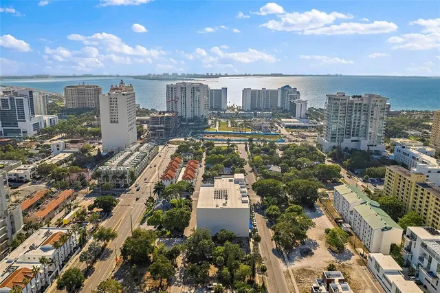 an aerial view of residential building and lake view