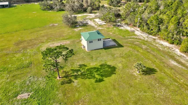 a view of outdoor space with deck and trees