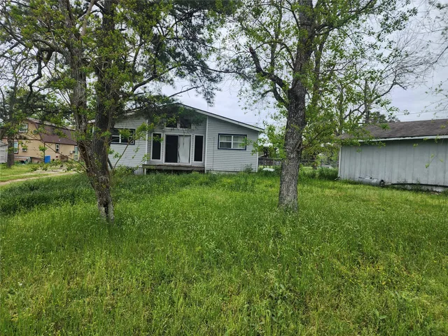 a house view with a garden space