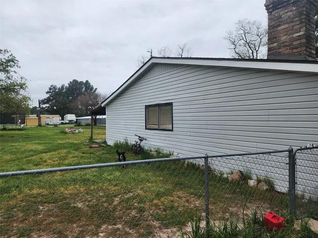 a backyard of a house with lots of green space