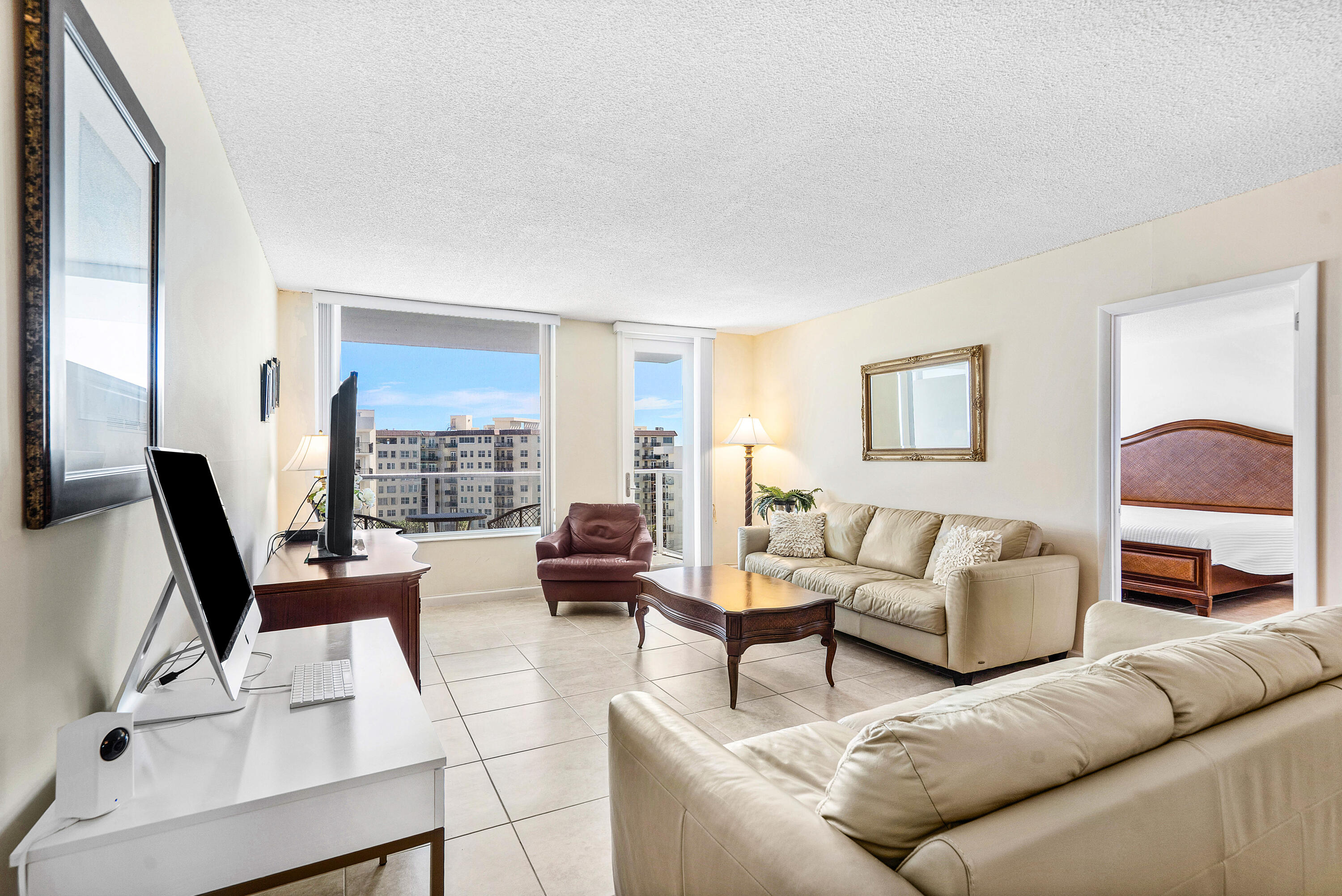 3450 South Ocean Boulevard, Unit 714 Palm Beach, FL 33480 - Photo 12 of 27 a living room with furniture and a large window