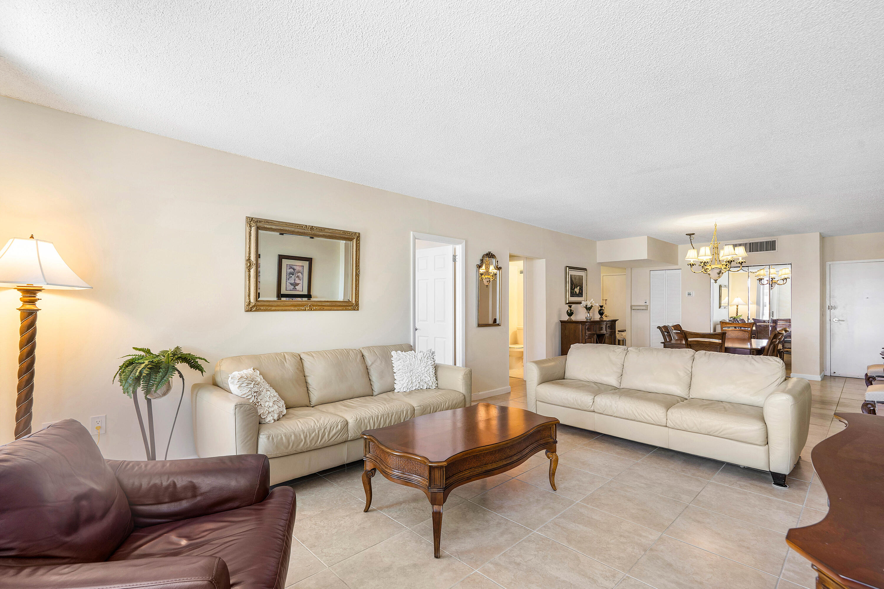 3450 South Ocean Boulevard, Unit 714 Palm Beach, FL 33480 - Photo 13 of 27 a living room with furniture and a couch