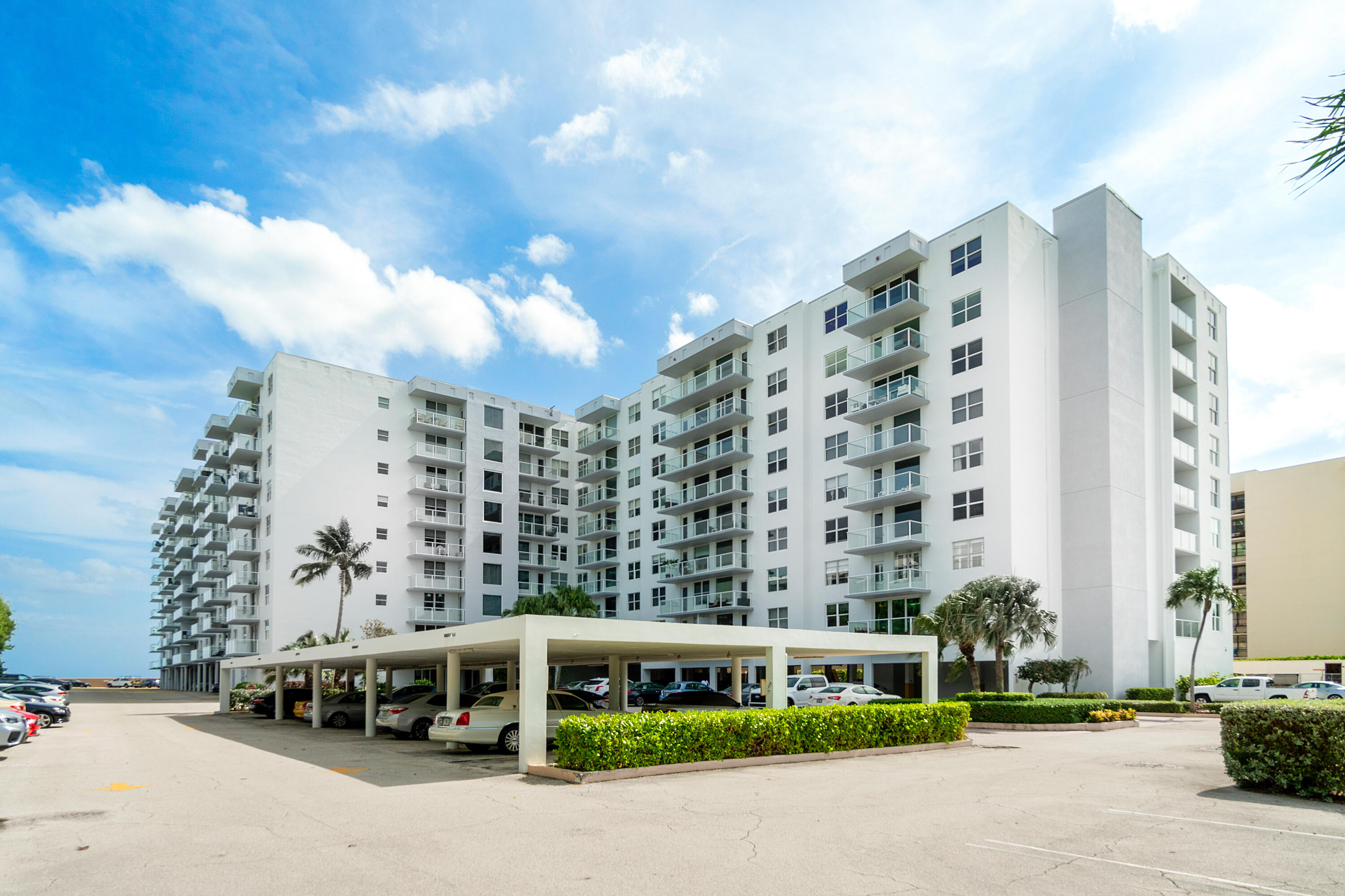 3450 South Ocean Boulevard, Unit 714 Palm Beach, FL 33480 - Photo 2 of 27 a multi story building with a outdoor space