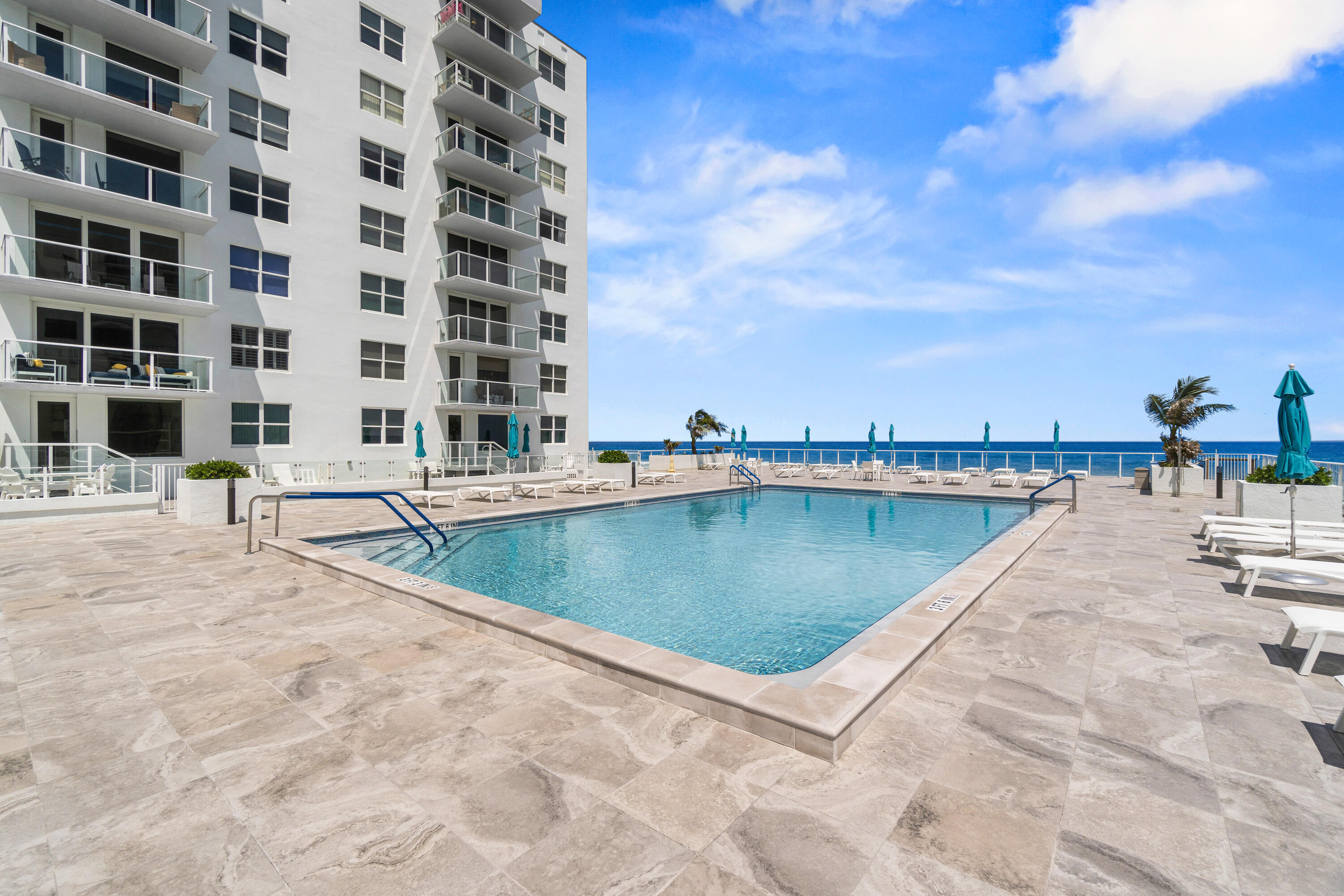 3450 South Ocean Boulevard, Unit 714 Palm Beach, FL 33480 - Photo 25 of 27 a view of swimming pool with outdoor seating