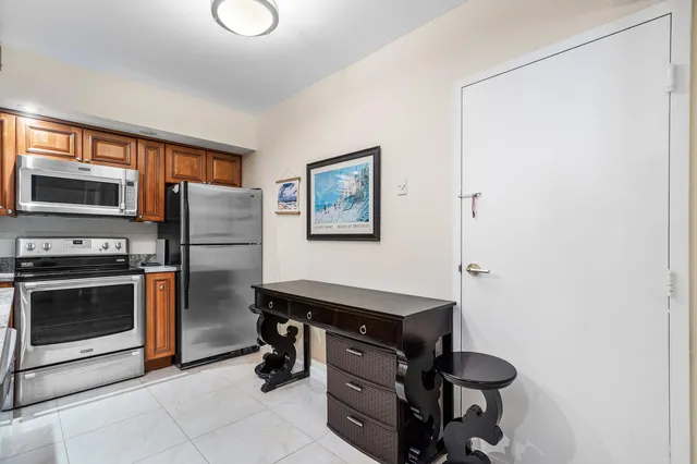 a kitchen with stainless steel appliances a stove and a refrigerator