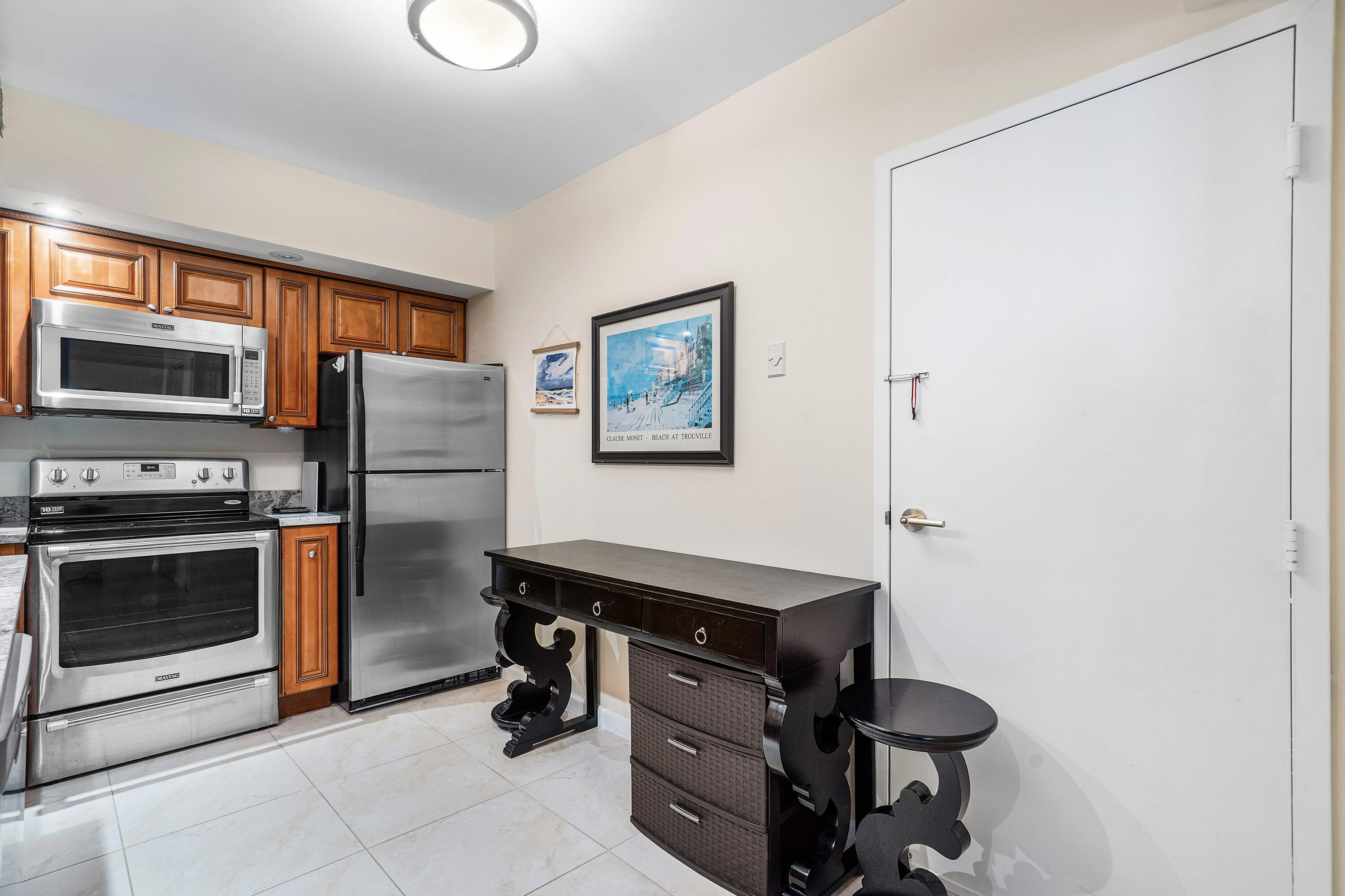 3450 South Ocean Boulevard, Unit 714 Palm Beach, FL 33480 - Photo 6 of 27 a kitchen with stainless steel appliances a stove and a refrigerator