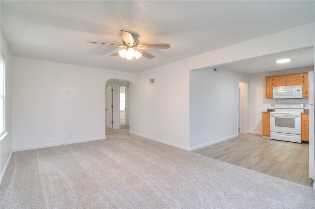 3506 East Leafdale Avenue Decatur, IL 62521 - Photo 13 of 25 wooden floor in an empty room with a window