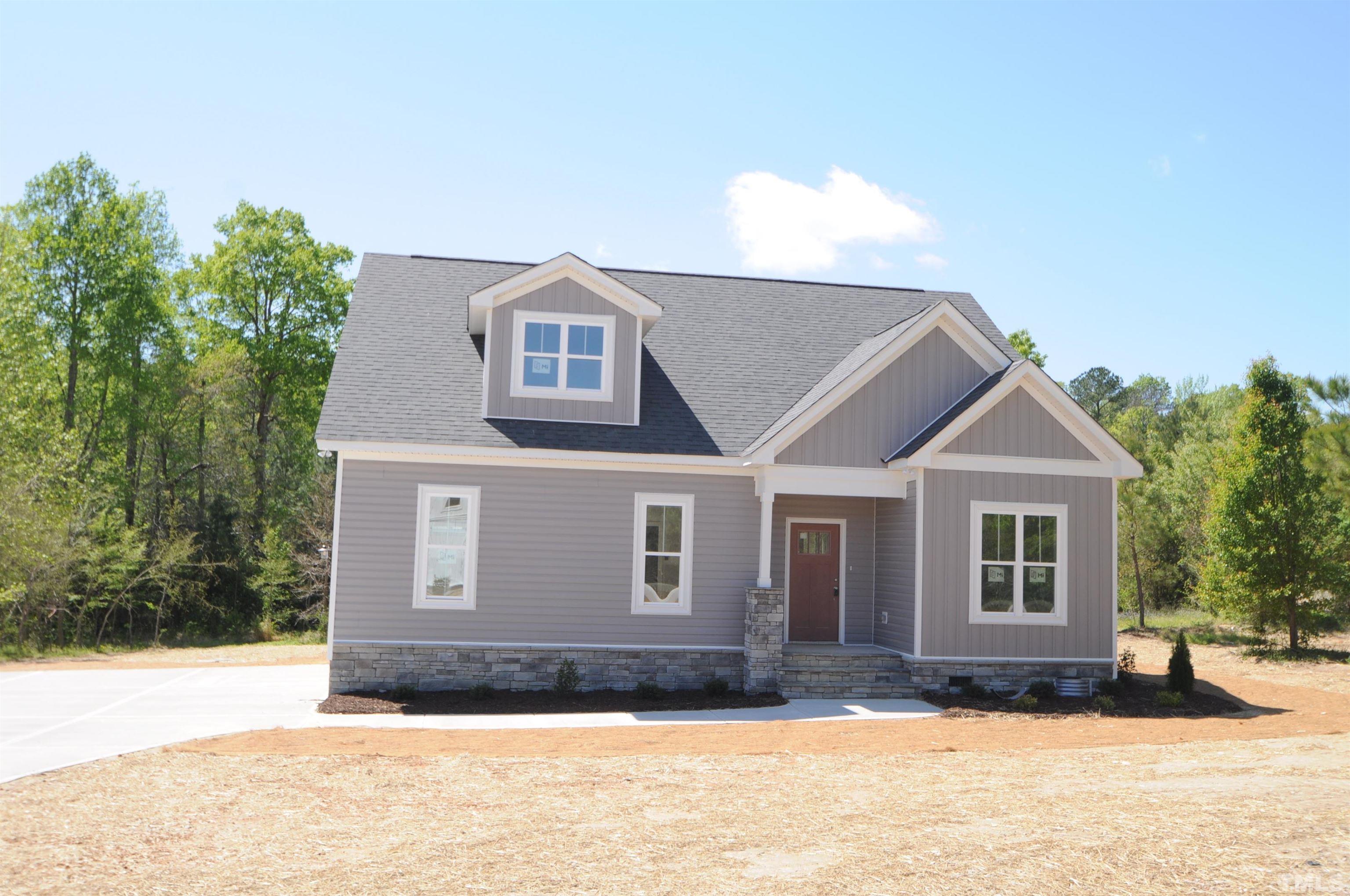 40 Pilot Ridge Road Zebulon, NC 27597 - Photo 1 of 11 a front view of a house with a yard
