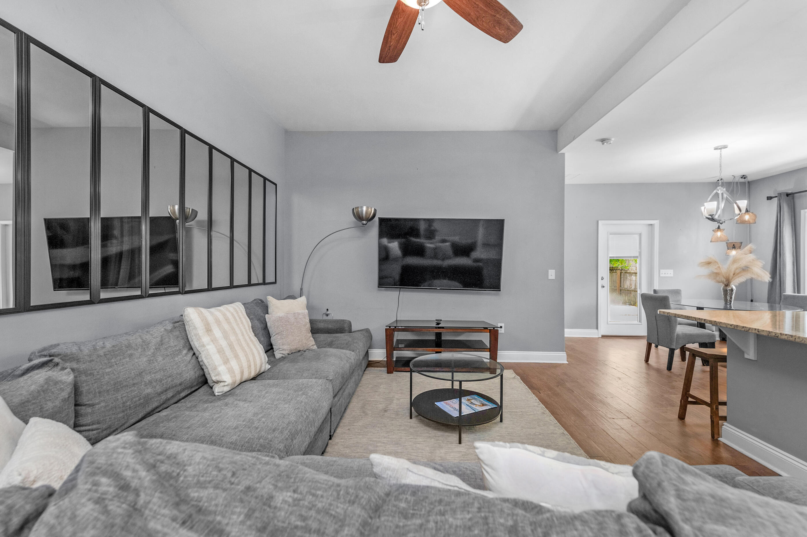 2269 Tom Street Navarre, FL 32566 - Photo 12 of 40 a living room with furniture ceiling fan and a flat screen tv