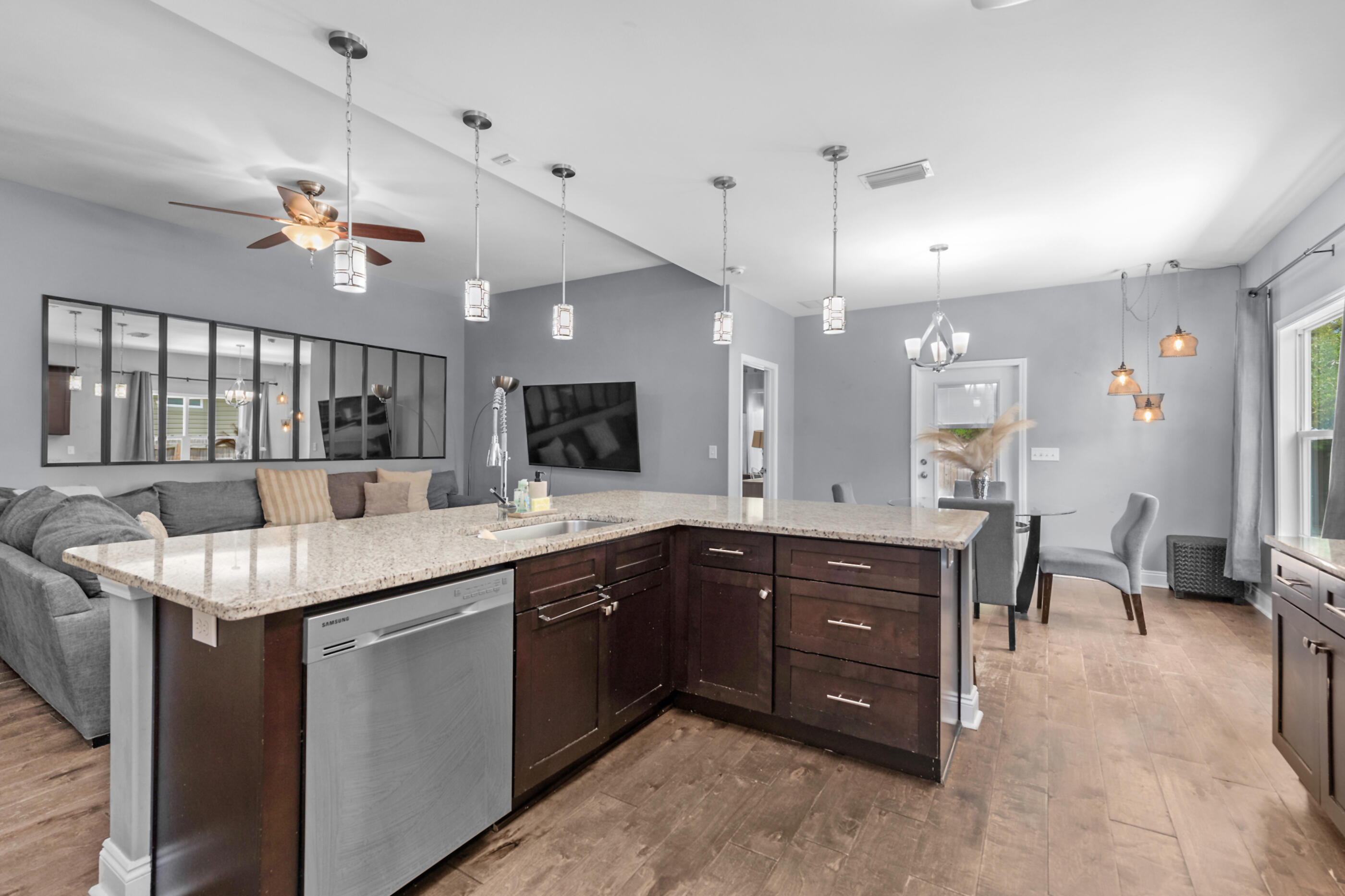 2269 Tom Street Navarre, FL 32566 - Photo 17 of 40 a kitchen with a sink a counter space appliances and a view of living room