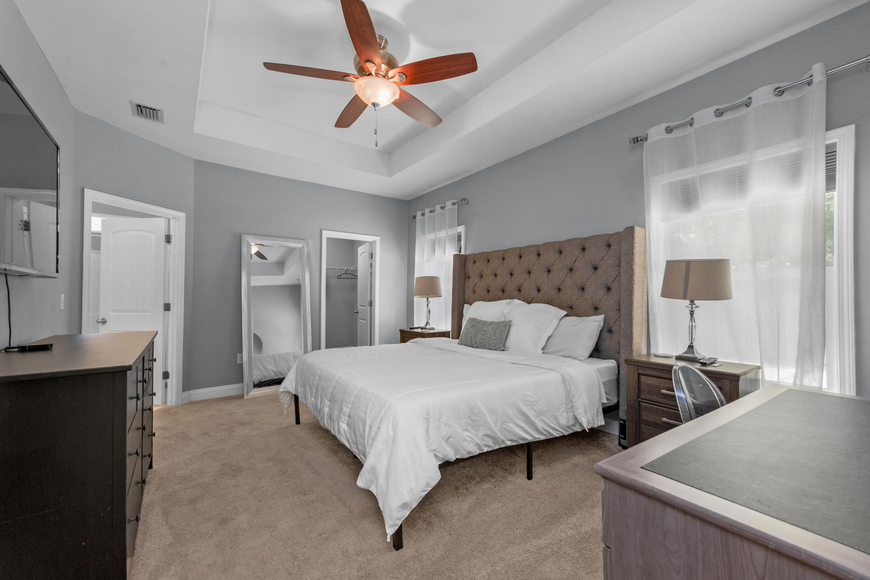 2269 Tom Street Navarre, FL 32566 - Photo 27 of 40 a bedroom with a bed and a chandelier