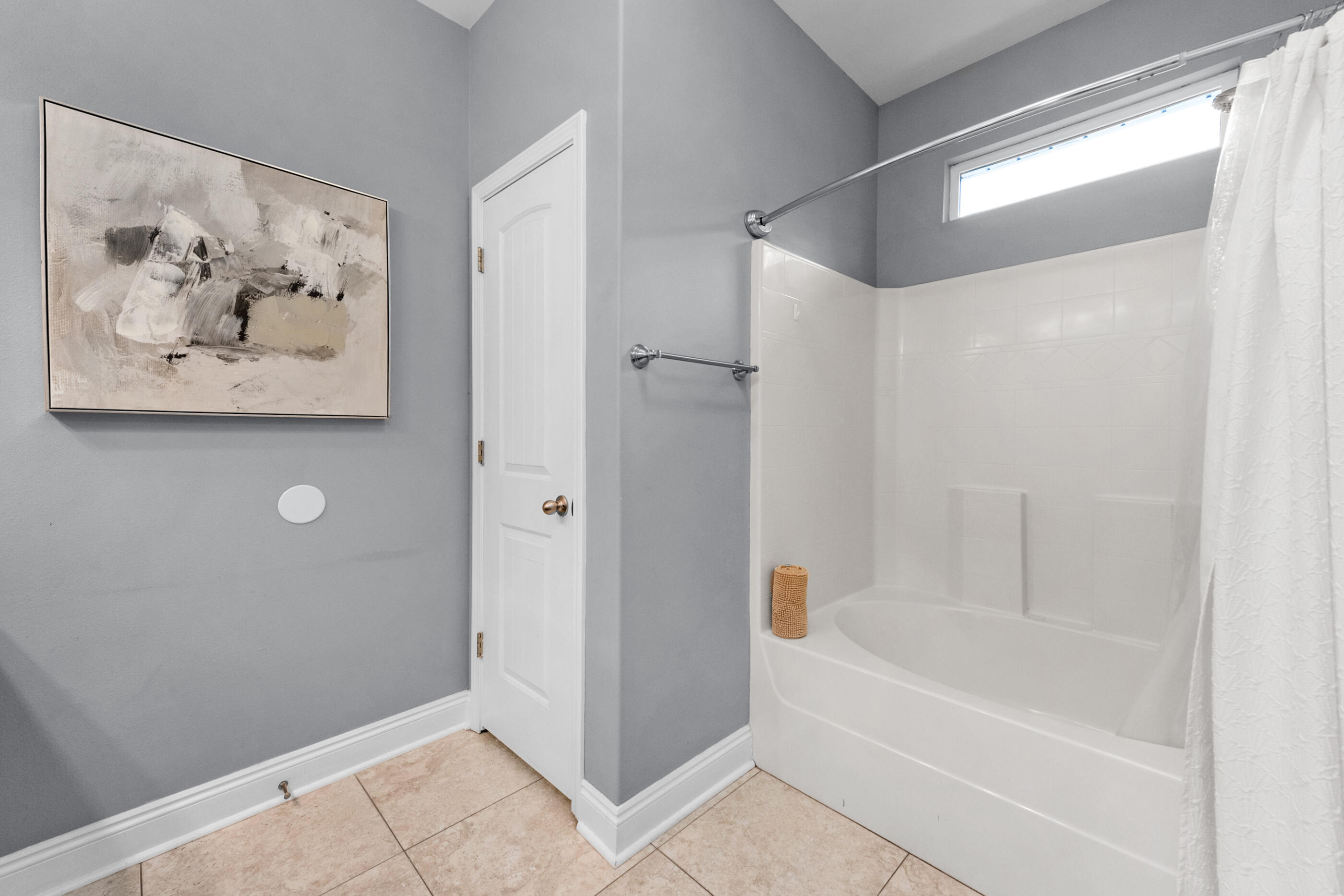 2269 Tom Street Navarre, FL 32566 - Photo 32 of 40 a bathroom with a bathtub and a shower