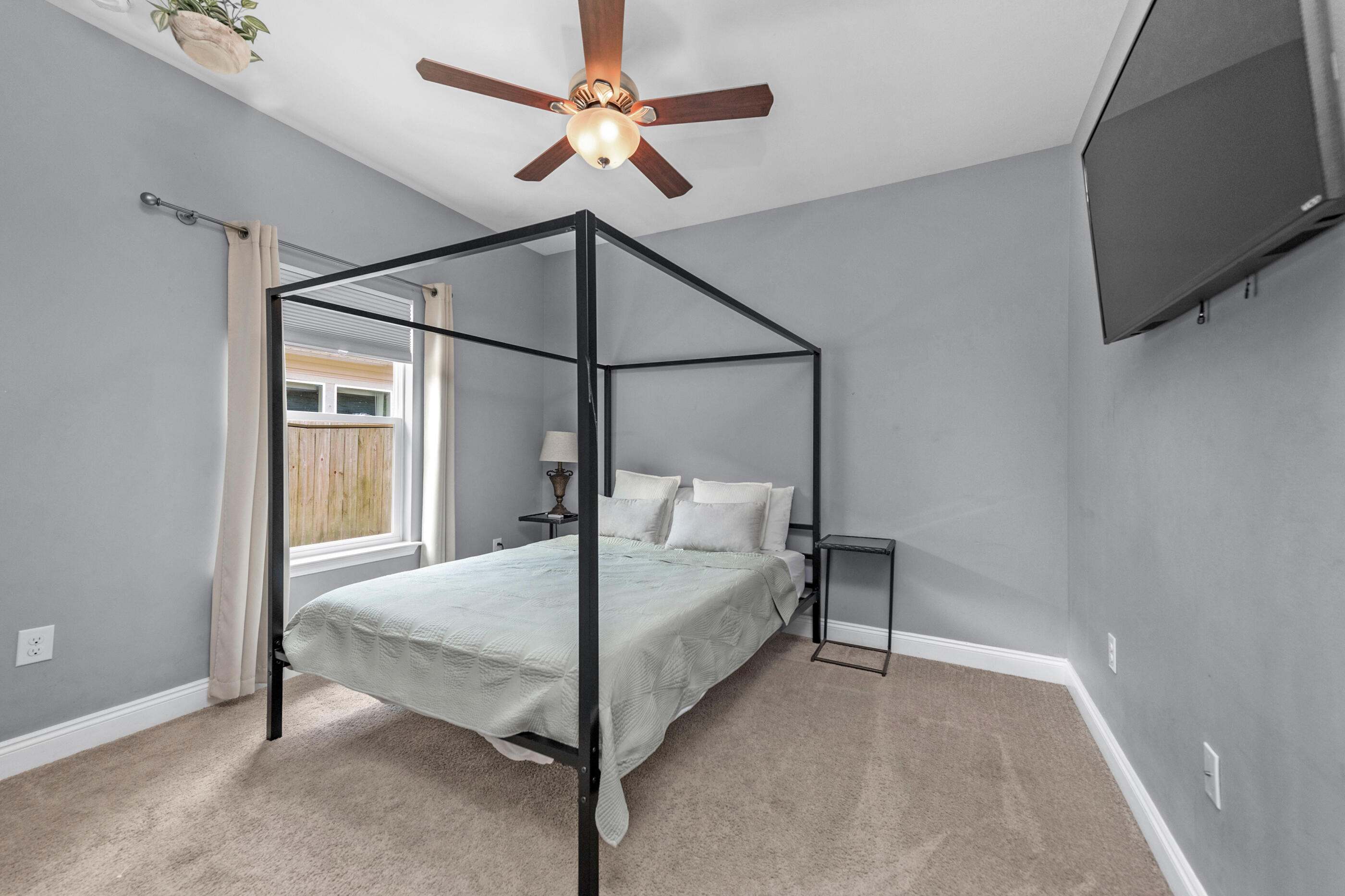 2269 Tom Street Navarre, FL 32566 - Photo 8 of 40 a bedroom with a bed and a window