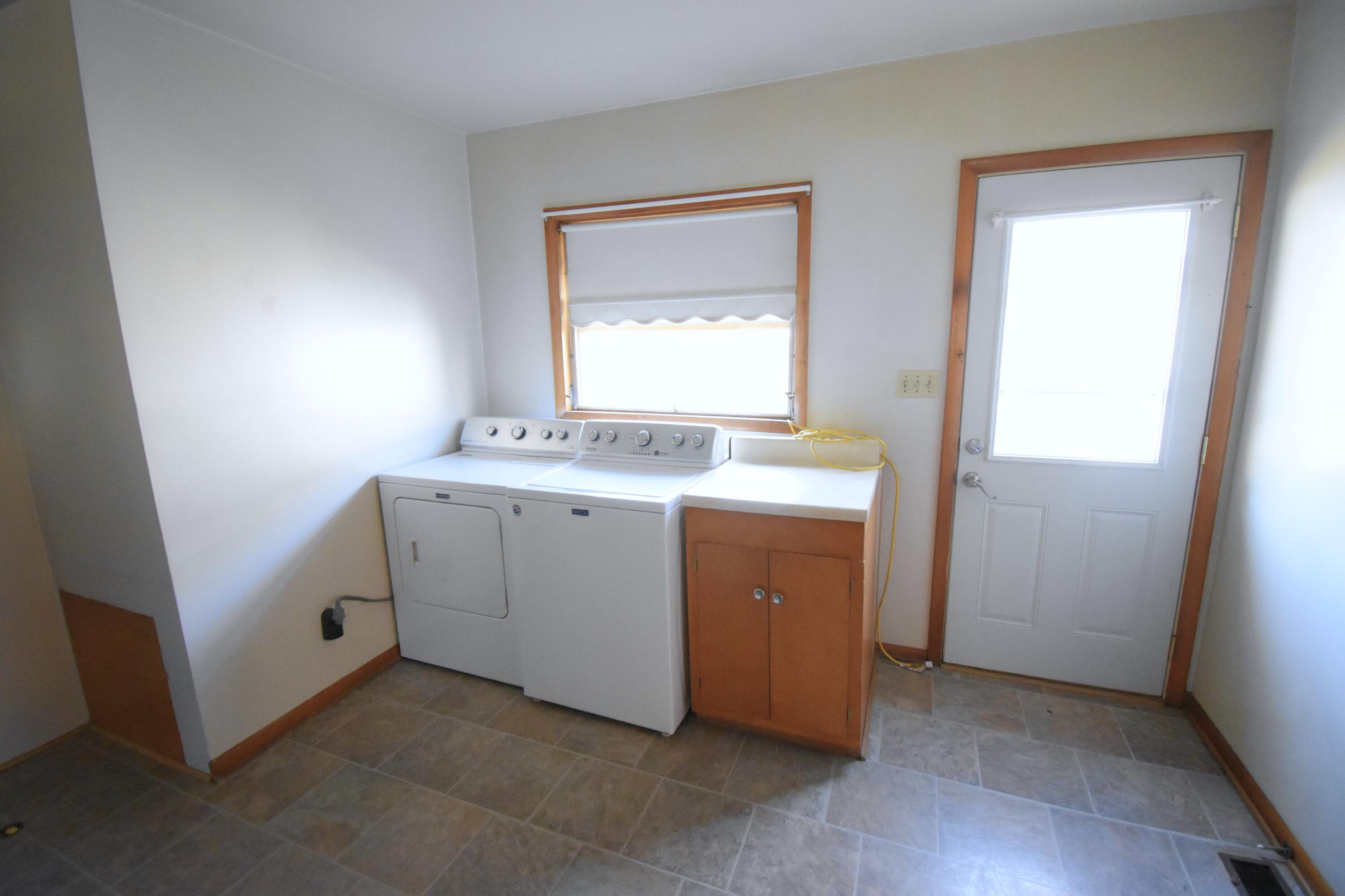 328 South Weston Street Rensselaer, IN 47978 - Photo 26 of 39 a utility room with a sink a washer and dryer