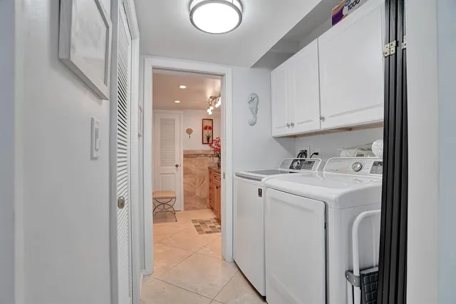 a view of a hallway with washer and dryer