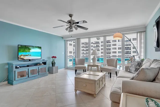 a kitchen with stainless steel appliances a refrigerator and a table