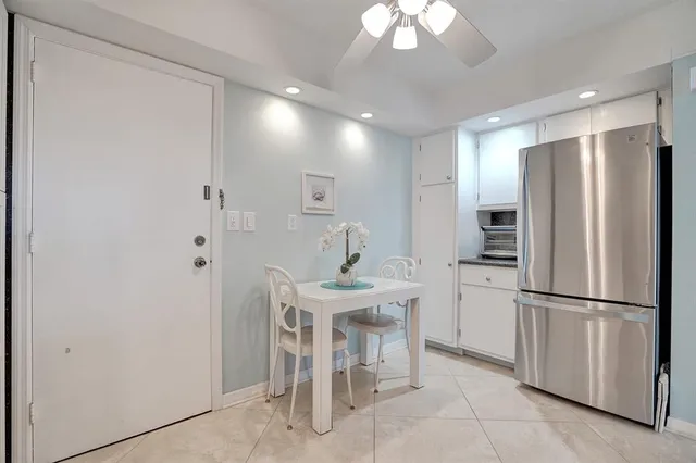 a stove top oven sitting inside of a kitchen