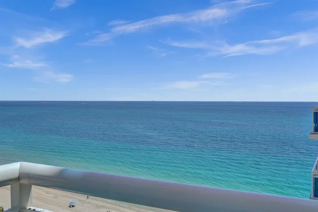 a view of an chairs and table in the balcony