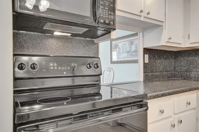 a spacious bedroom with a large bed and a window