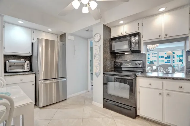 a bed room with a bed and a large window