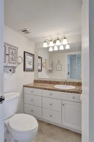 a view of a backyard with a table and chairs under an umbrella