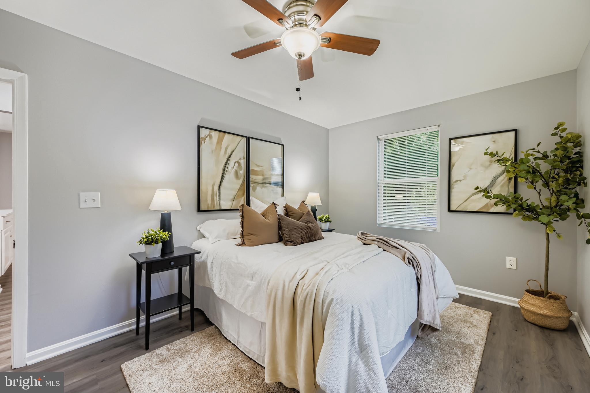 1229 North Point Road Dundalk, MD 21222 - Photo 11 of 28 a bedroom with a bed and a chandelier