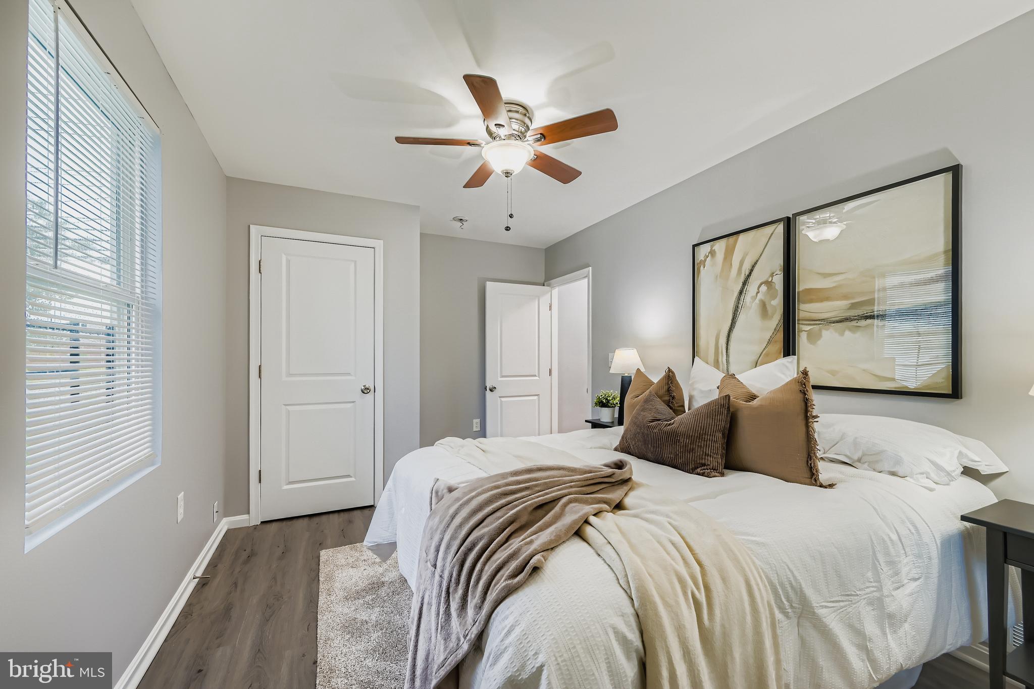 1229 North Point Road Dundalk, MD 21222 - Photo 12 of 28 a bedroom with a bed and window