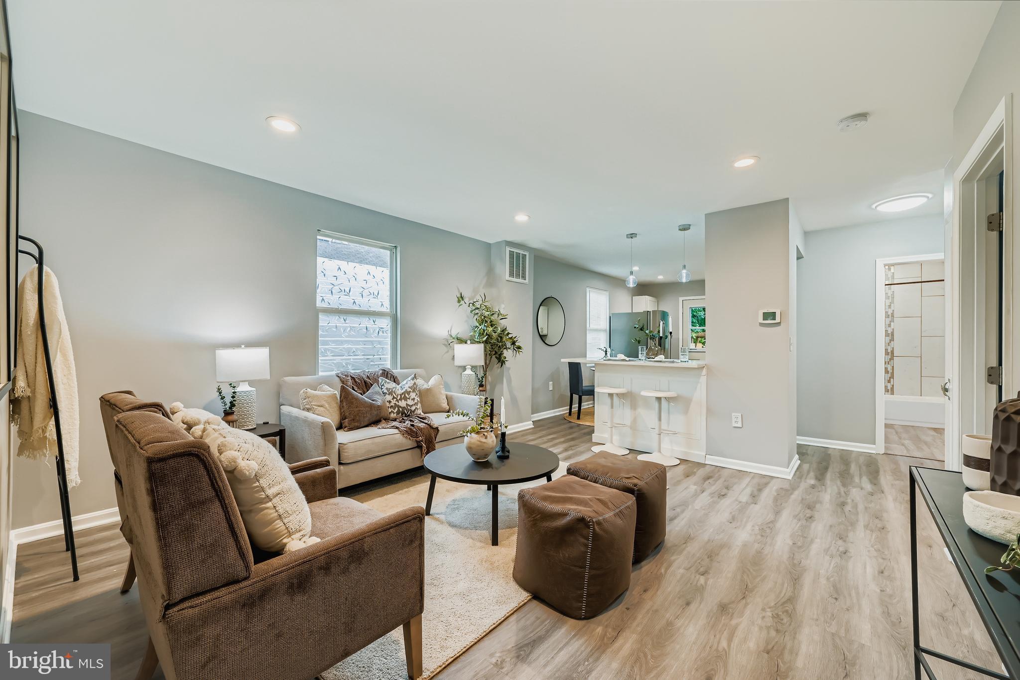 1229 North Point Road Dundalk, MD 21222 - Photo 2 of 28 a living room with furniture a wooden floor and a large window