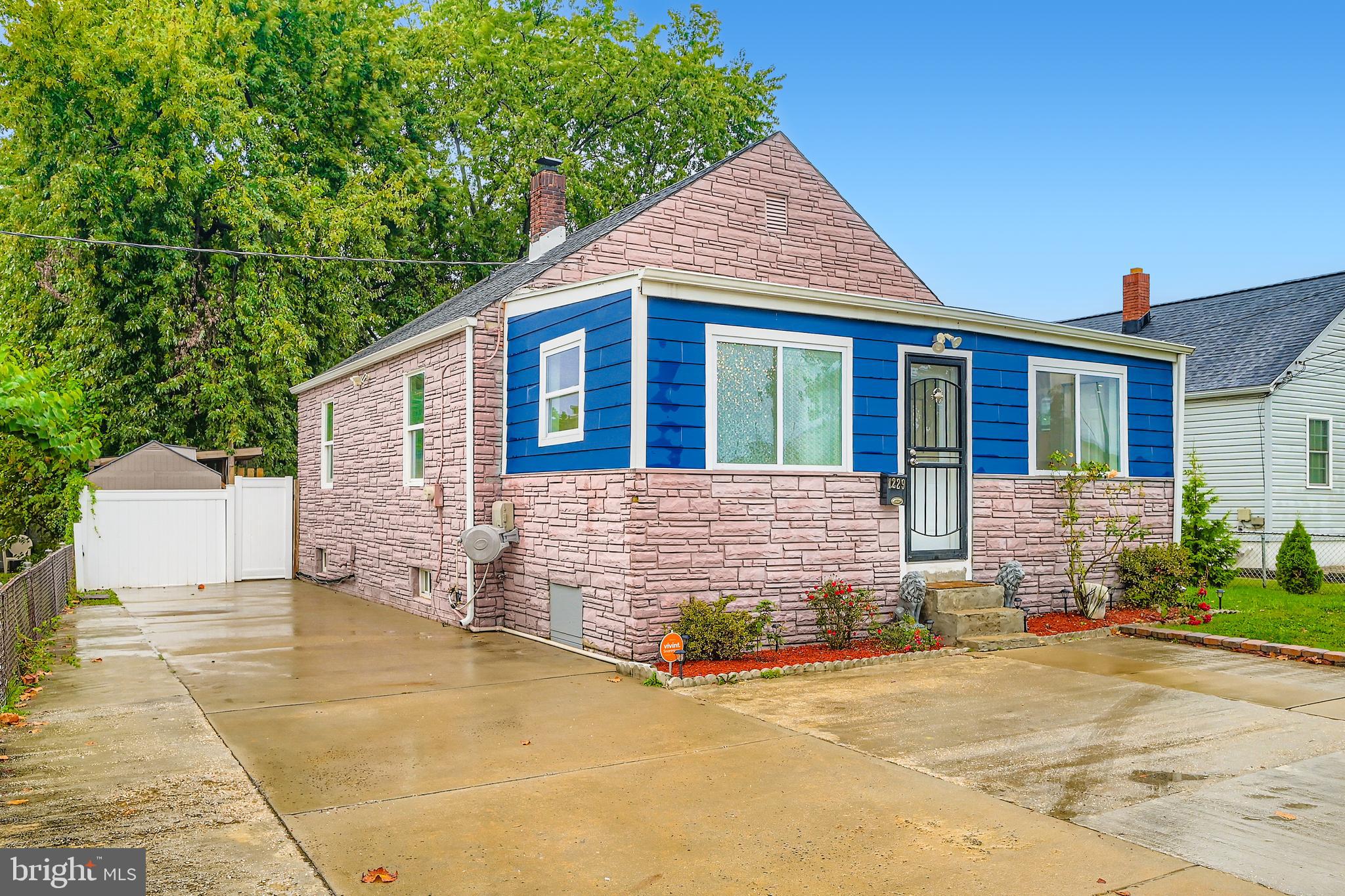 1229 North Point Road Dundalk, MD 21222 - Photo 22 of 28 a front view of a house with a garden