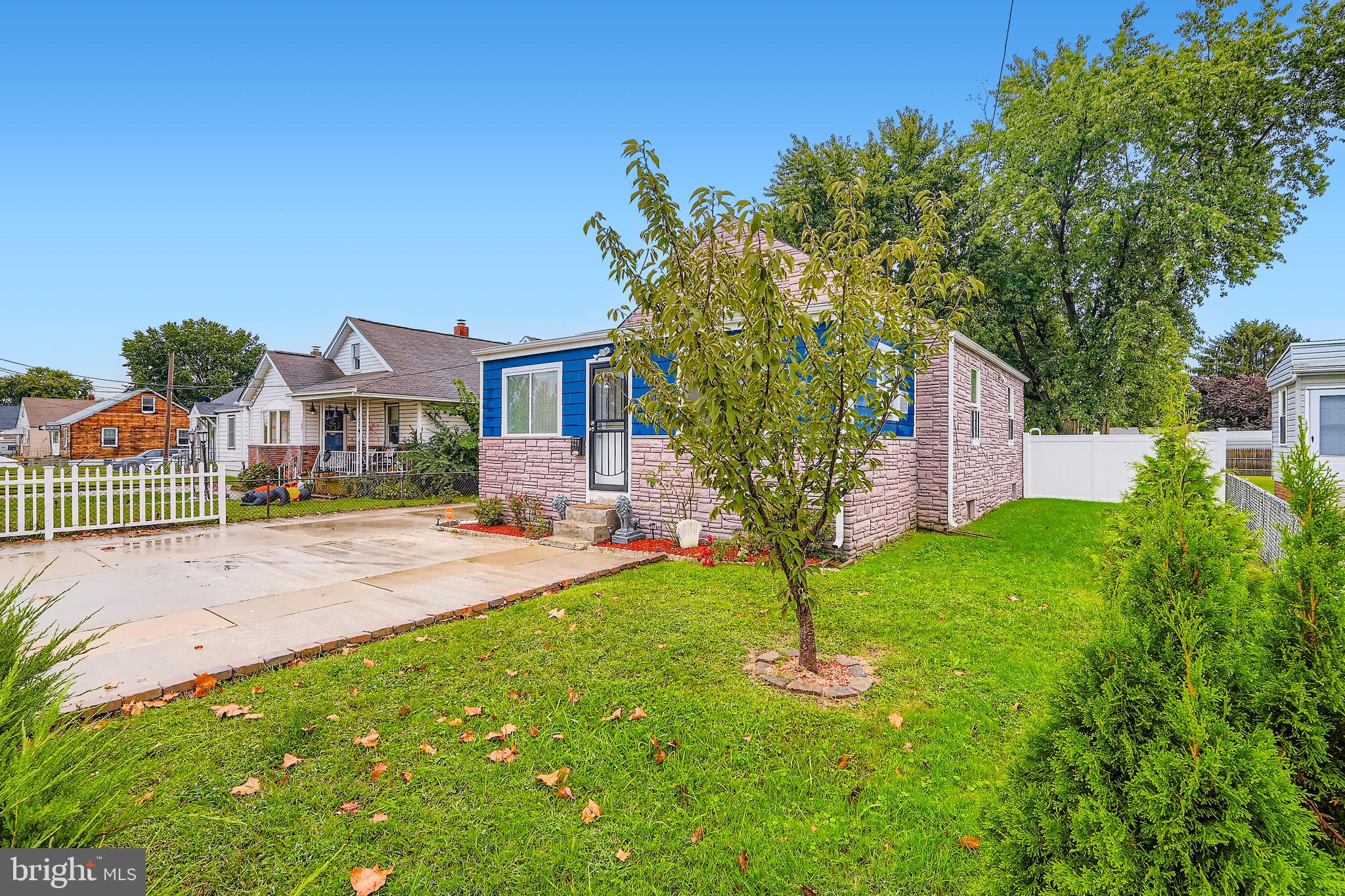 1229 North Point Road Dundalk, MD 21222 - Photo 23 of 28 a front view of a house with a yard