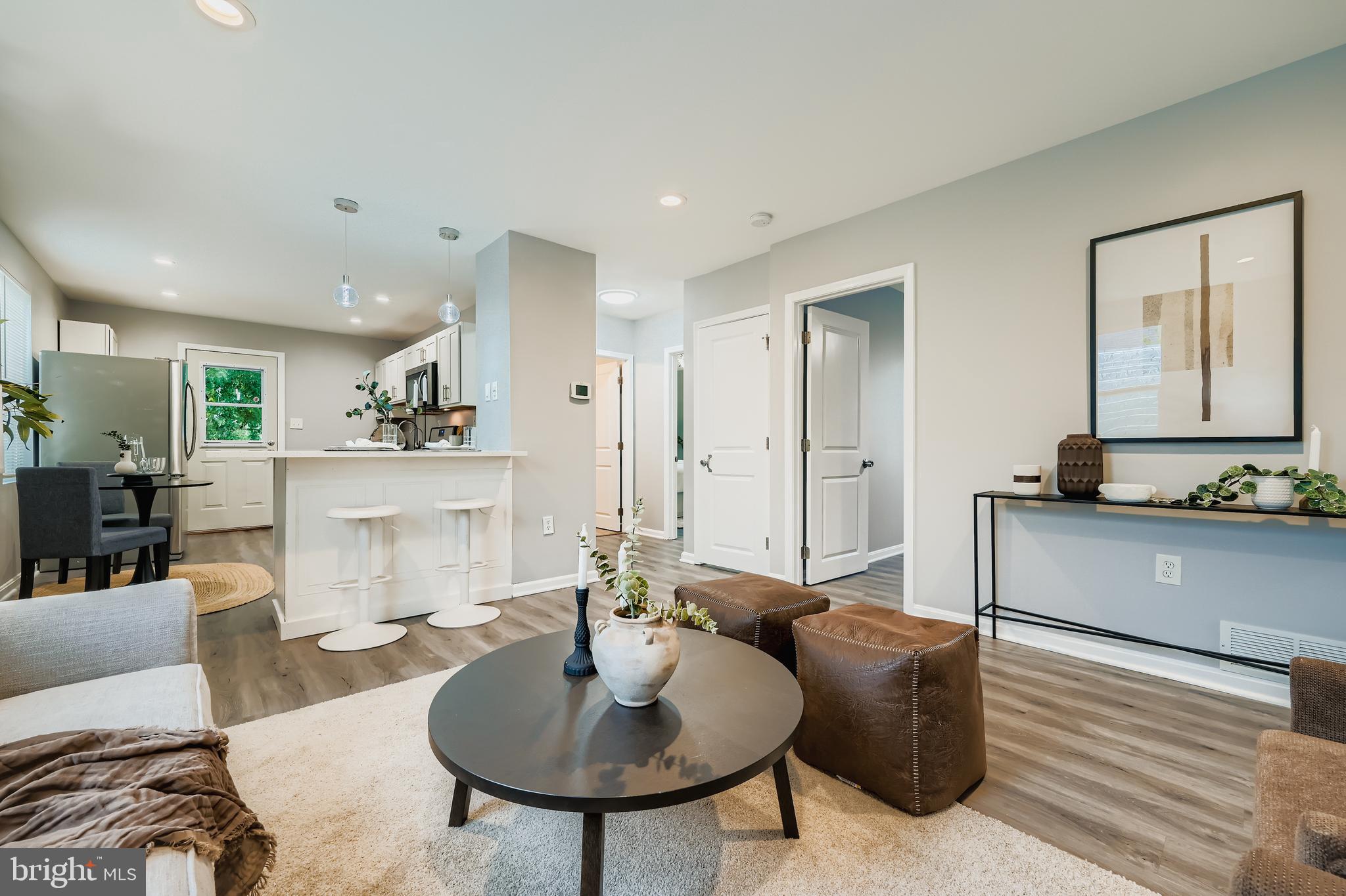 1229 North Point Road Dundalk, MD 21222 - Photo 3 of 28 a living room with furniture and a wooden floor
