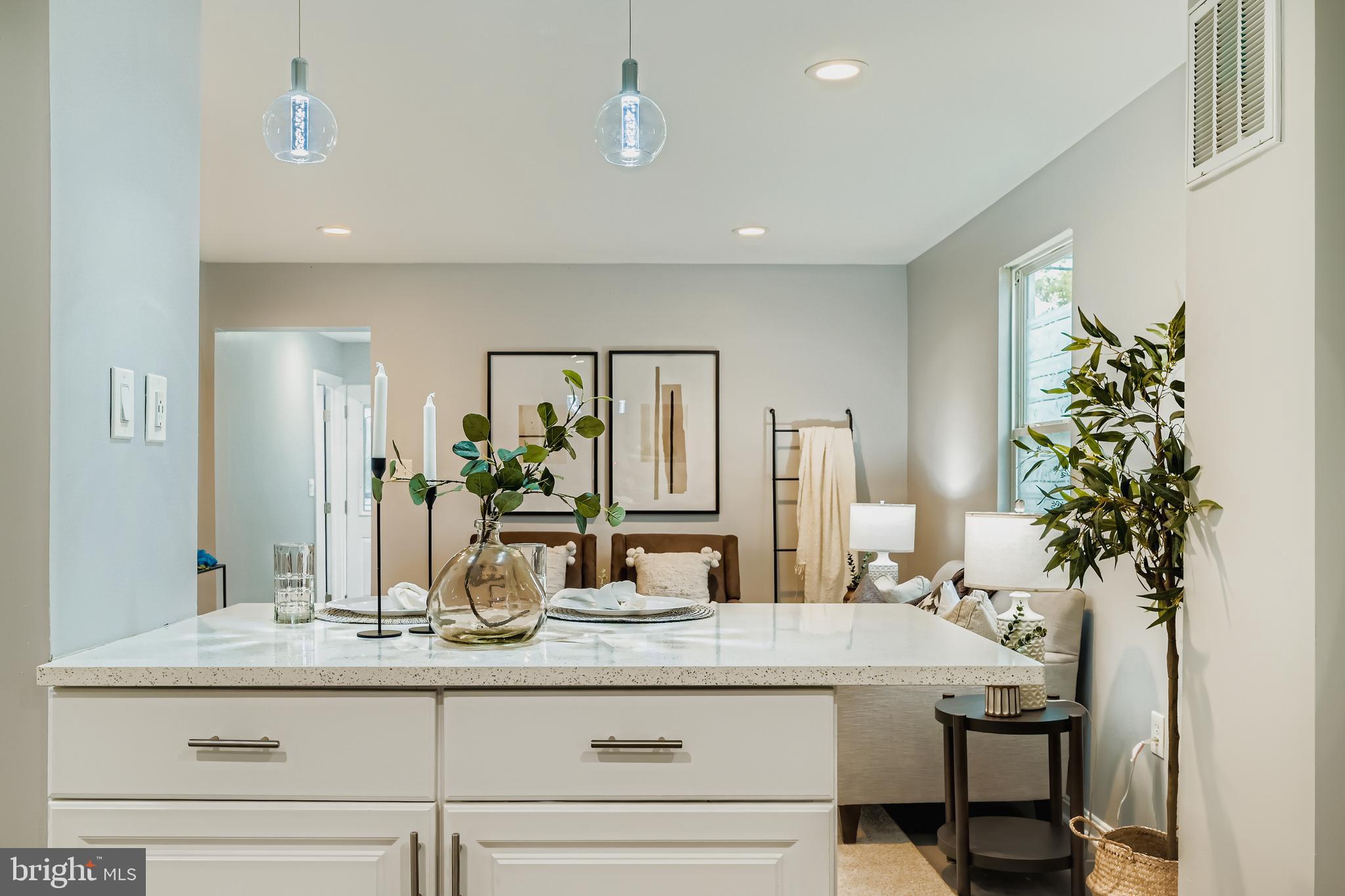 1229 North Point Road Dundalk, MD 21222 - Photo 8 of 28 a bathroom with a granite countertop sink a mirror and a potted plant